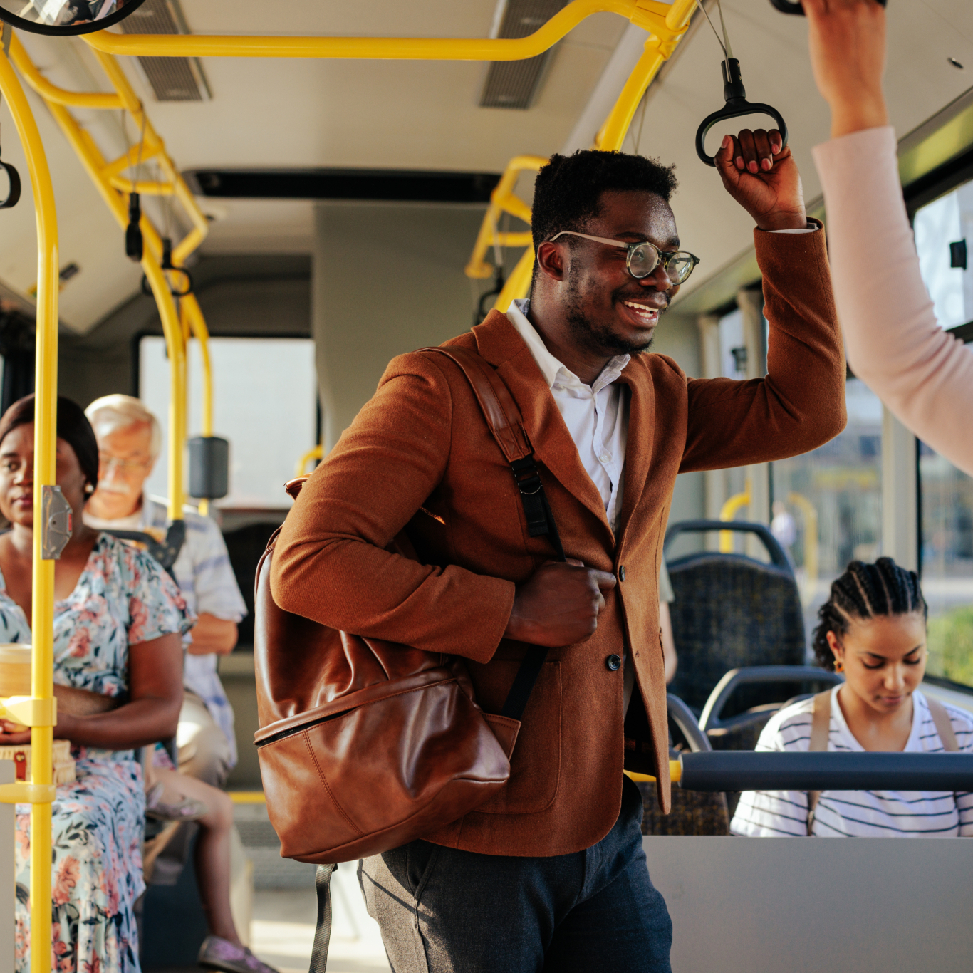 Two passengers are talking in the city bus